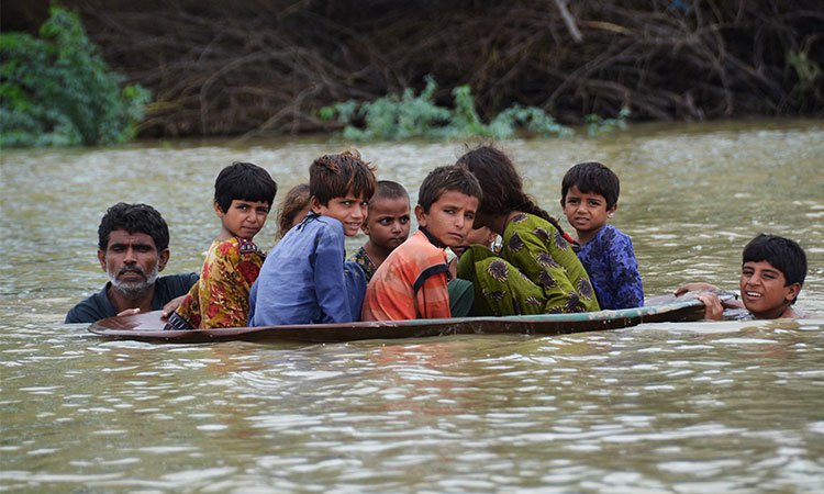 Pakistan PM pleas for help as flooding death toll tops 900 — a third of them children